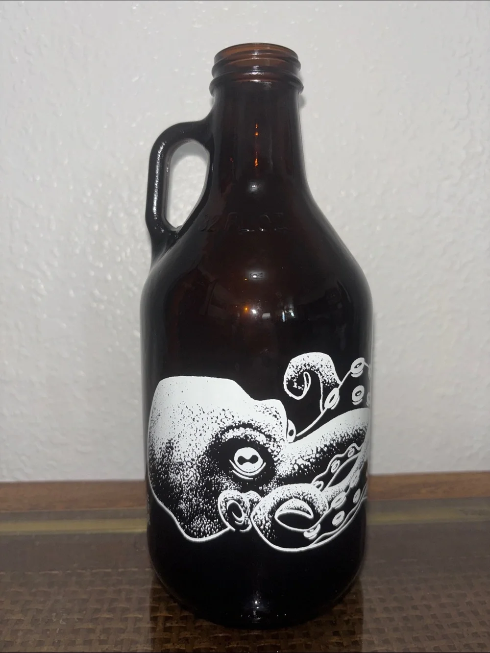 Amber Glass Growler with White Octopus Graphic